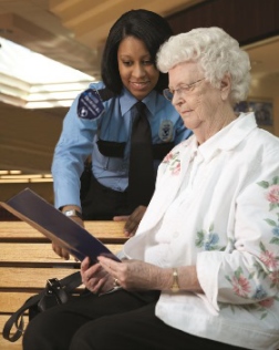 security professional assisting elderly