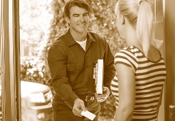 home repairman handing homeowner business card