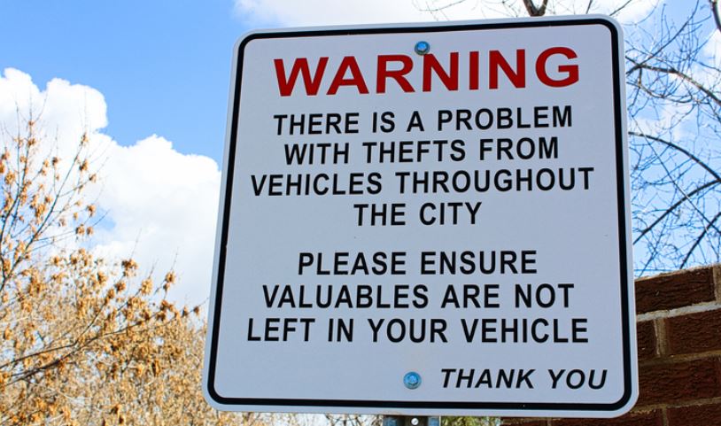 sign: warning there is a problem with thefts from vehicles throughout the city. Please ensure valuables are not left in your vehicle