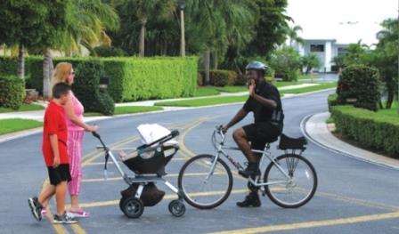 Security Officer on Bike Greeting Pedestrians 