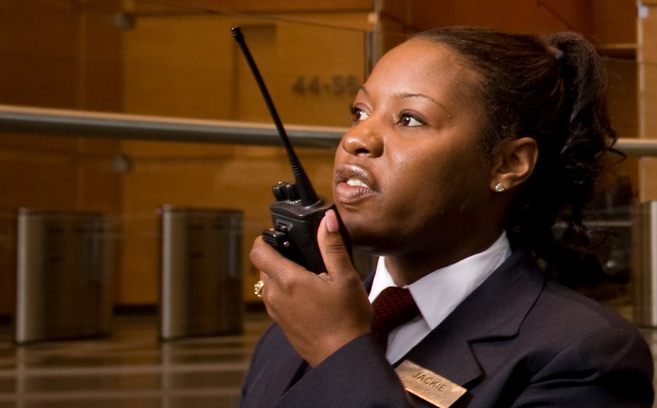 Security Guard Talking Via Walkie-Talkie