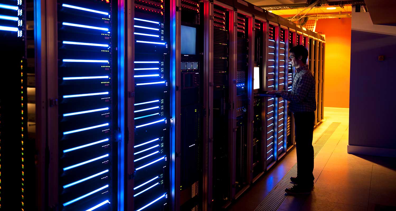 person working at computer server desk