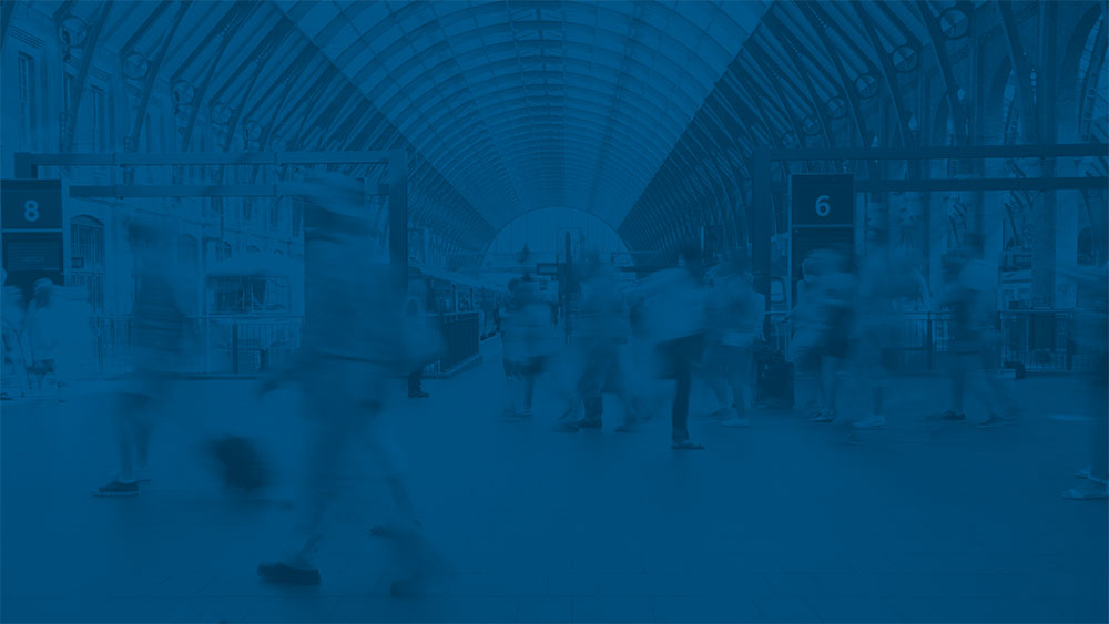 People walking through train station