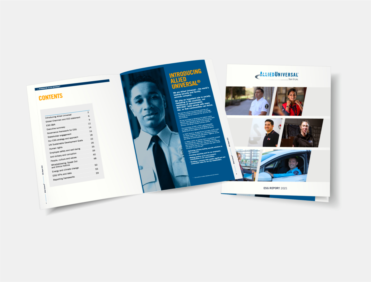 Photo of a book open to a page of photos of AUS employees