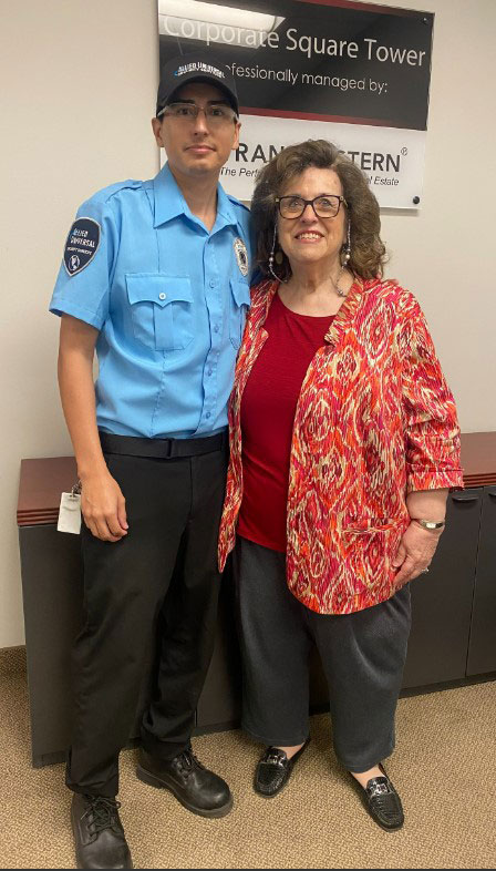 Security Professional Chris with woman he saved from fire