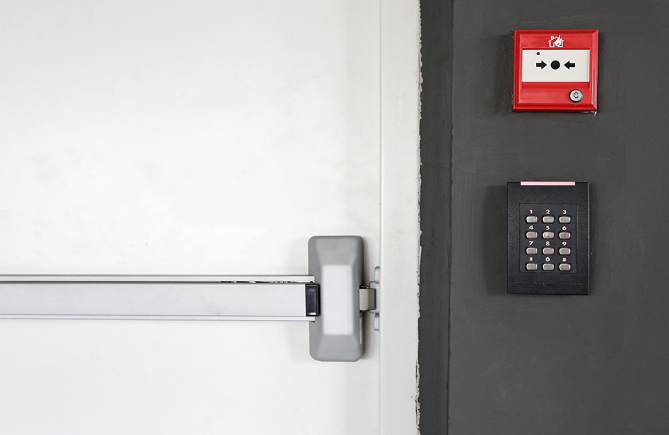 keypad and fire alarm on wall