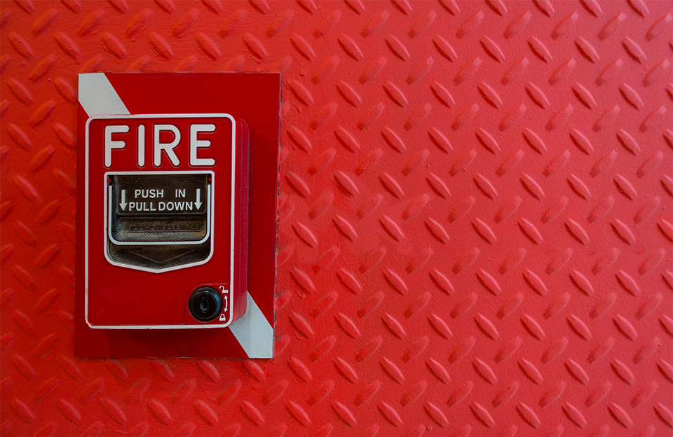 fire alarm on red wall