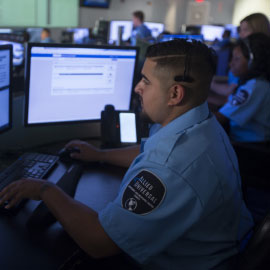 man typing on computer