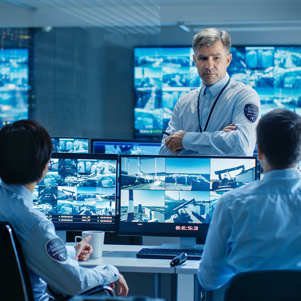 security professionals monitoring surveillance footage