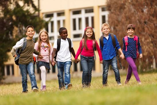 children holding hands and smiling