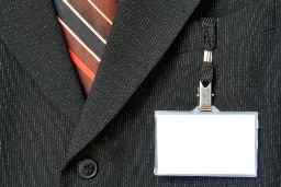 professional wearing suit with work badge