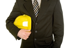 business professional holding hard hat 