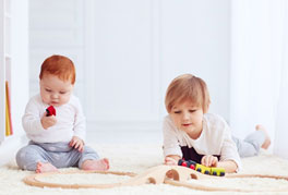 Children playing with small toys