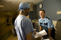 security professional interacting with medical professional