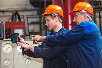 Workers looking at tablet