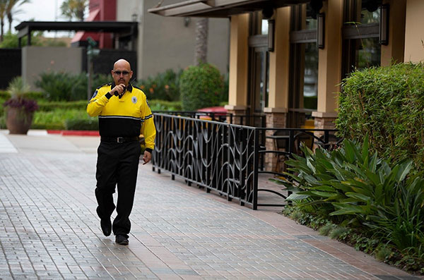 Security officers walking with walkie talkie