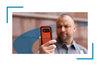 A man holding a mobile in his hands