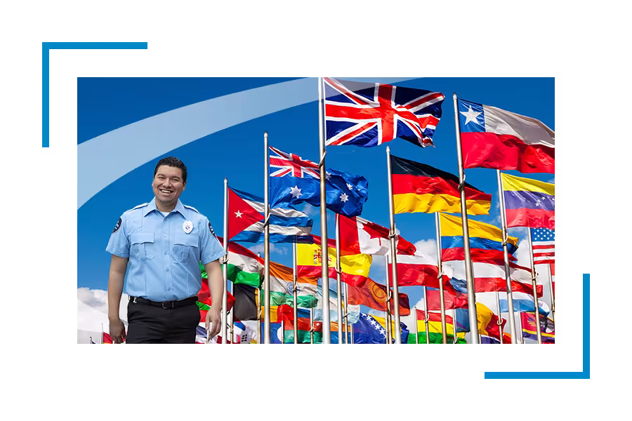 Security guard in front of national flags