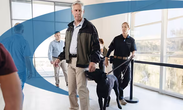 Allied Universal Security guard with canine