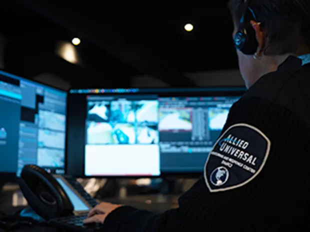 security professional looking at monitor