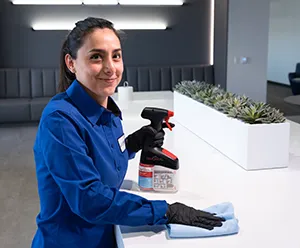 woman cleaning lobby county, janitorial services