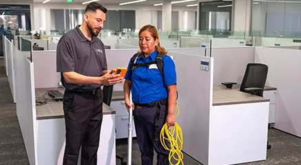 two people standing in office, janitorial services