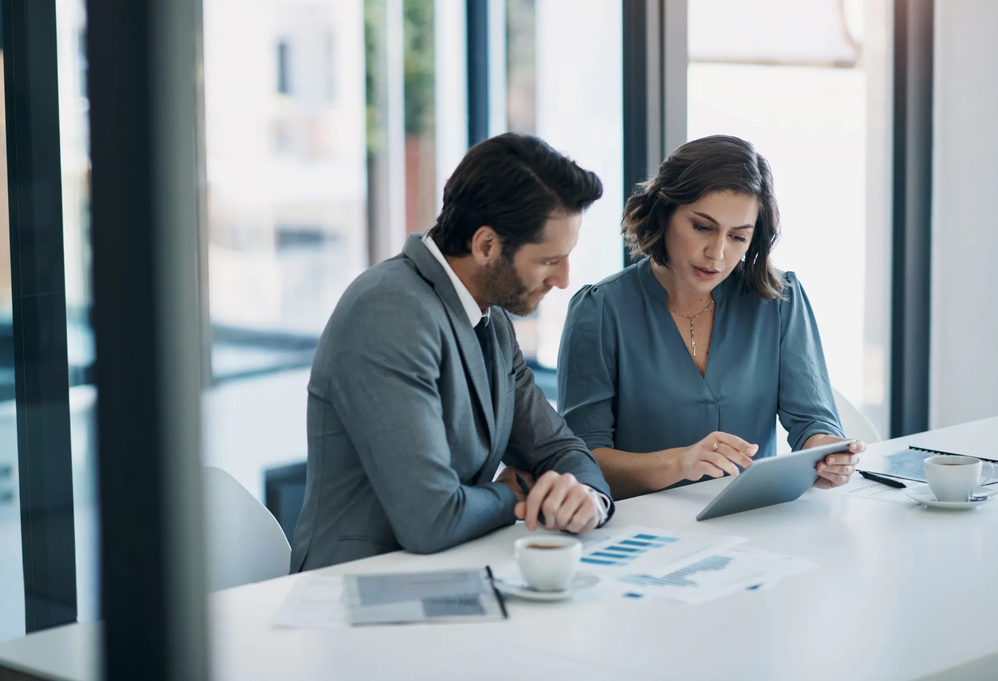 Two pwoplw looking at tablet