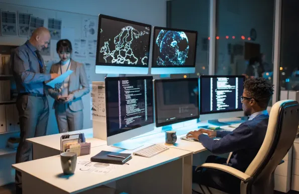 People working in a control room.