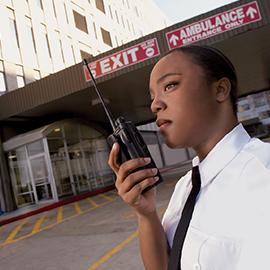 security professional patrolling in front of hospital