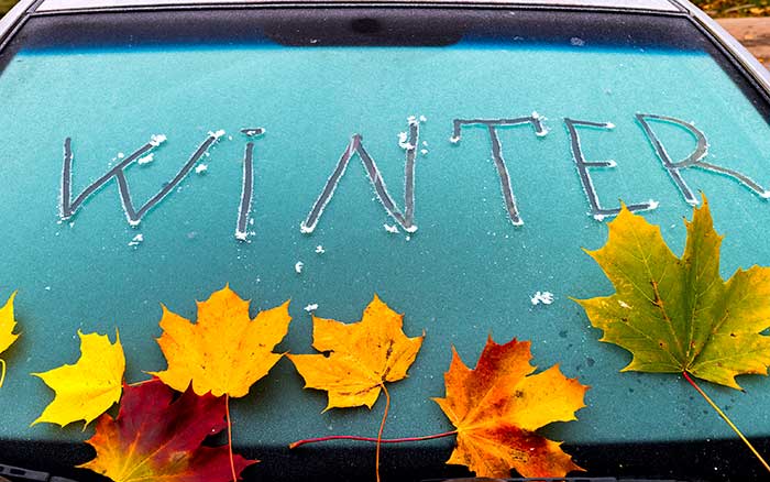 Winter written on windshield