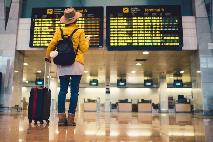 Woman with suitcase in airport